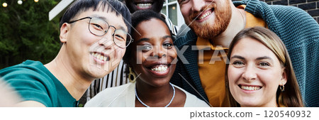 POV of multiethnic group of friends smiling happily at camera taking selfie photo together outdoors in house yard POV of multiethnic group of friends smiling happily at camera taking selfie photo together outdoors in house yard 120540932