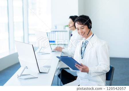 A medical professional operator wearing a white coat A medical professional operator wearing a white coat 120542057