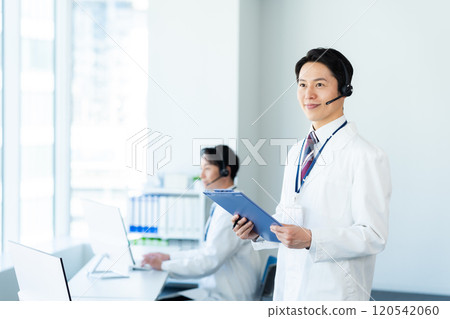 A medical professional operator wearing a white coat A medical professional operator wearing a white coat 120542060