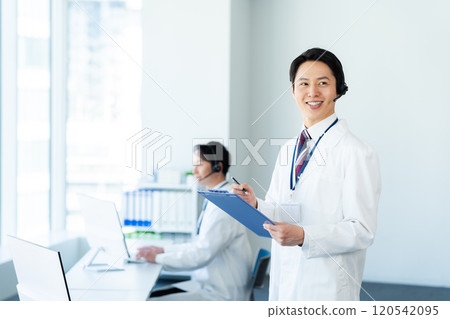 A medical professional operator wearing a white coat A medical professional operator wearing a white coat 120542095