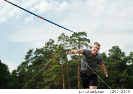 Throwing Javelin in Outdoor Athletic Field 120542100