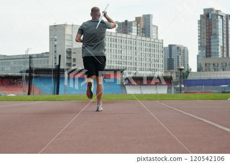 Athlete Running and Preparing for Javelin Throw Practice 120542106