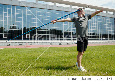 Throwing Javelin on Sports Field in Sunny Weather 120542161