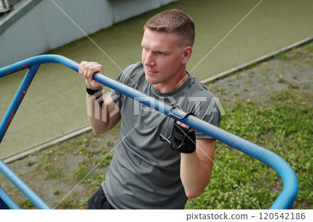 Exercising on Outdoor Fitness Equipment Exercising on Outdoor Fitness Equipment 120542186