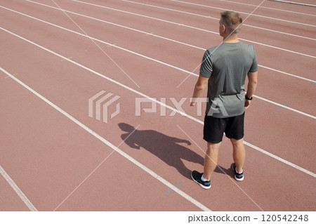 Standing Alone on Running Track Looking Forward Standing Alone on Running Track Looking Forward 120542248