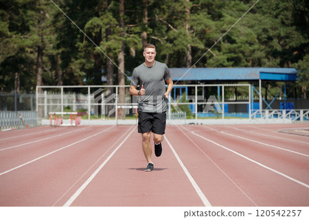 Running on Outdoor Track Surrounded by Trees Running on Outdoor Track Surrounded by Trees 120542257