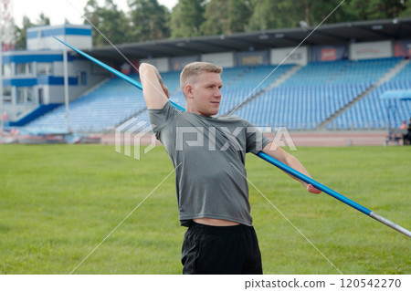 Man Participating In Javelin Throwing Session Outside Man Participating In Javelin Throwing Session Outside 120542270