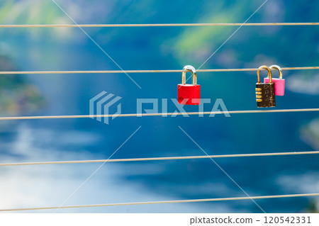 Red padlock and Geirangerfjord from Flydasjuvet viewpoint Norway 120542331