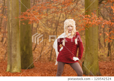 Fashion woman in windy fall autumn park forest. Fashion woman in windy fall autumn park forest. 120542524