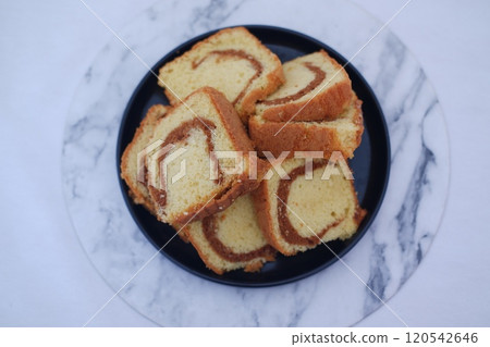 sponge cake on a plate with white background 120542646