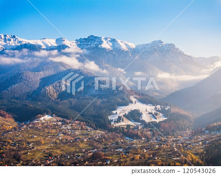 Aerial drone view of Bucegi Mountains in autumn season with blue sky 120543026