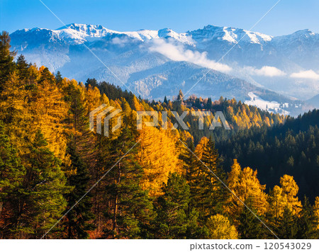 Aerial drone view of Bucegi Mountains in autumn season with blue sky 120543029