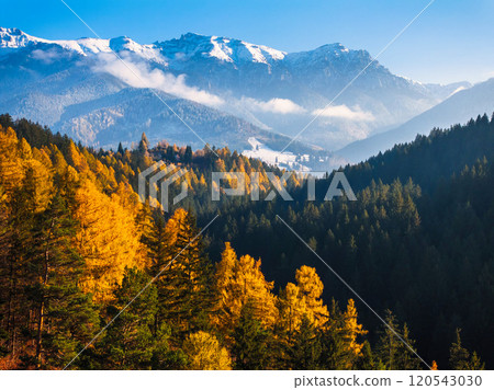 Aerial drone view of Bucegi Mountains in autumn season with blue sky 120543030