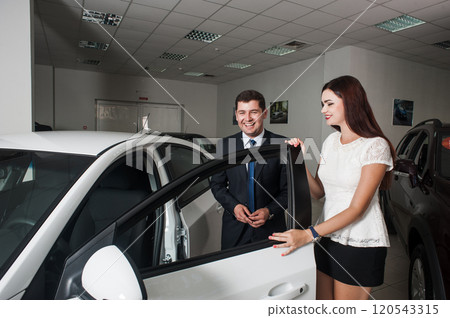 Buying an electric car. Car dealership. 120543315