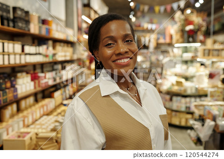 Portrait of Smiling Female Employee Working in Retail Store 120544274
