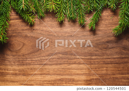 Chrismtas background top view with fir branches on wood background with copy space 120544501