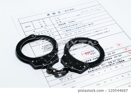 Image of a dark job: arrest warrant and black handcuffs 120544687