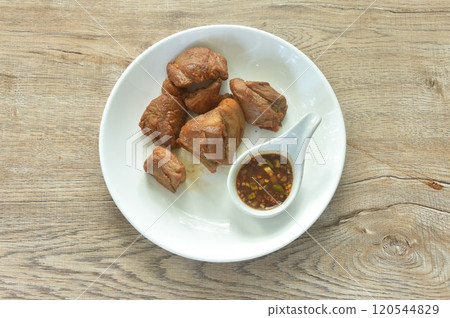 fried crispy slice fat pork in fish sauce on plate dipping with chili sauce fried crispy slice fat pork in fish sauce on plate dipping with chili sauce 120544829