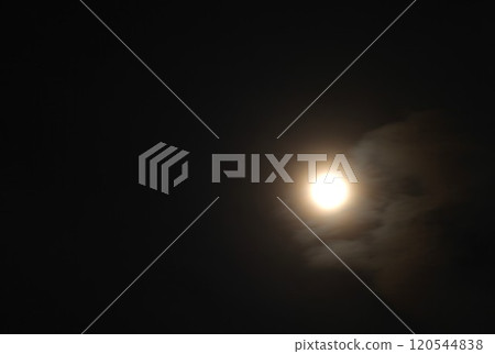 yellow full moon covering by cloud floating on sky in night background yellow full moon covering by cloud floating on sky in night background 120544838