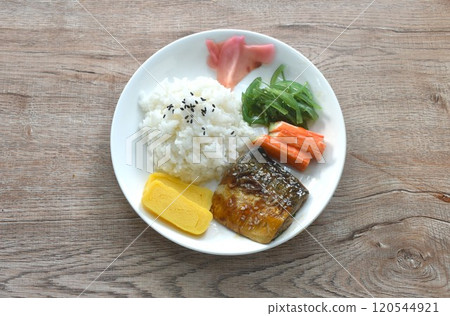 grilled saba fish or mackerel on rice topping sweet egg and crab stick couple pickled pink ginger and seaweed salad in plate grilled saba fish or mackerel on rice topping sweet egg and crab stick couple pickled pink ginger and seaweed salad in plate 120544921