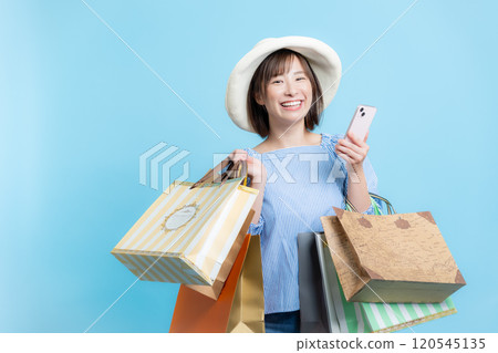 Woman shopping image 120545135