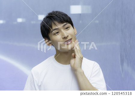 Young man touching his cheek, beauty boy Young man touching his cheek, beauty boy 120545318
