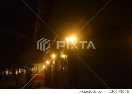 electric lamp on wall of building  in the night 120545646