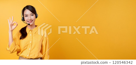 A female operator in her 20s making an OK sign. 120546342