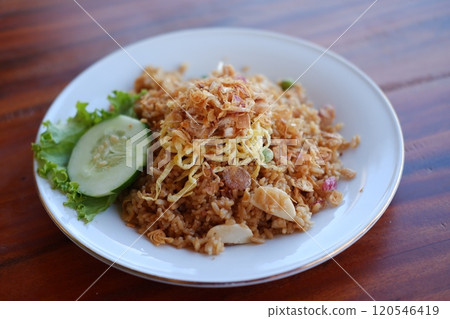 seafood fried rice with egg on wooden table seafood fried rice with egg on wooden table 120546419