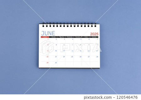 June 2025 Monthly desk calendar for 2025 year on blue background. Flat lay. 120546476