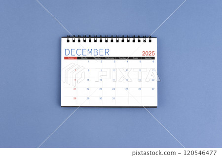 December 2025 Monthly desk calendar for 2025 year on blue background. Flat lay. December 2025 Monthly desk calendar for 2025 year on blue background. Flat lay. 120546477