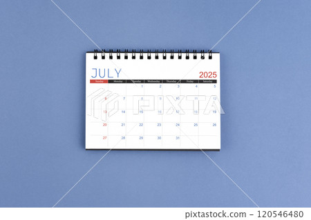 July 2025 Monthly desk calendar for 2025 year on blue background. Flat lay. 120546480