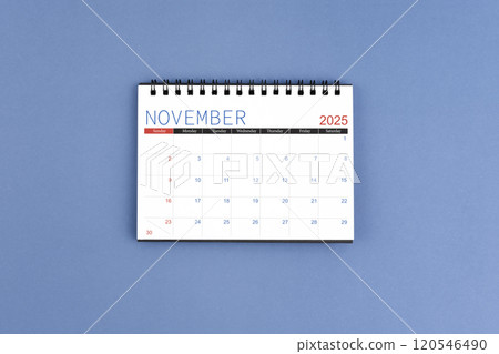 November 2025 Monthly desk calendar for 2025 year on blue background. Flat lay. 120546490