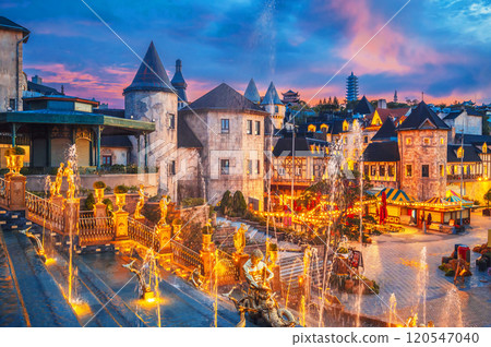 Beautiful French village in medieval European style in Ba Na Hills park in Da Nang in Vietnam at sunset Beautiful French village in medieval European style in Ba Na Hills park in Da Nang in Vietnam at sunset 120547040