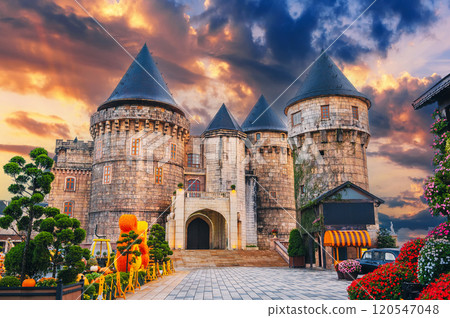 medieval castle in French village in Ba Na Hills Park in Da Nang in Vietnam at sunset 120547048