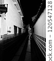 A long, narrow passageway in an alley 120547128