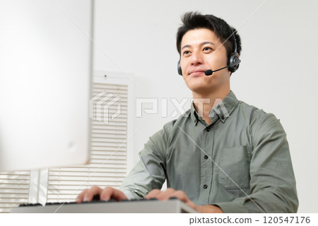 Man having a video conference 120547176