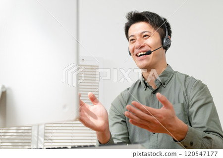 Man having a video conference 120547177