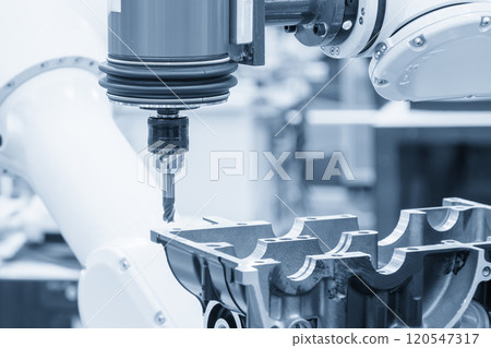 Closeup scene the milling spindle attached on the robotic arm finish cut the aluminum gear case. 120547317
