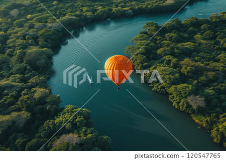 Hot air balloon is floating over a river. Aerial view 120547765