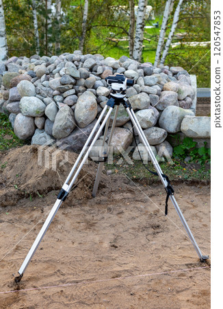 Surveyor equipment,  theodolite on the construction site. 120547853