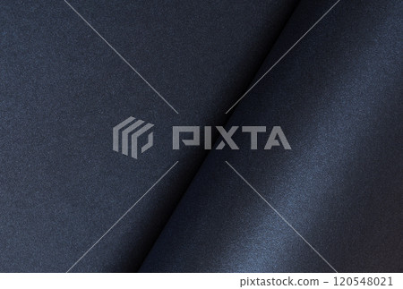 Dark blue rolled paper background with a smooth, shiny surface. Elegant and minimalist design with Dark blue rolled paper background with a smooth, shiny surface. Elegant and minimalist design with 120548021
