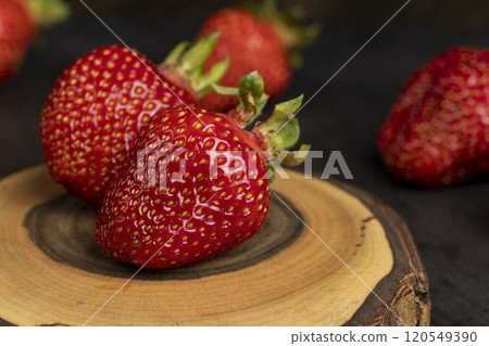 several red sweet strawberries in close-up 120549390