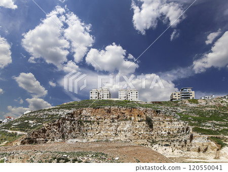 Amman city landmarks-- old roman Citadel Hill, Jordan. Against the background of a beautiful sky with clouds Amman city landmarks-- old roman Citadel Hill, Jordan. Against the background of a beautiful sky with clouds 120550041
