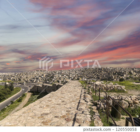 Amman city landmarks-- old roman Citadel Hill, Jordan. Against the background of a beautiful sky with clouds Amman city landmarks-- old roman Citadel Hill, Jordan. Against the background of a beautiful sky with clouds 120550058