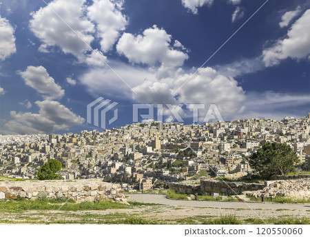 Amman city landmarks-- old roman Citadel Hill, Jordan. Against the background of a beautiful sky with clouds Amman city landmarks-- old roman Citadel Hill, Jordan. Against the background of a beautiful sky with clouds 120550060