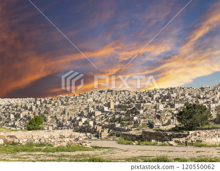 Amman city landmarks-- old roman Citadel Hill, Jordan. Against the background of a beautiful sky with clouds Amman city landmarks-- old roman Citadel Hill, Jordan. Against the background of a beautiful sky with clouds 120550062
