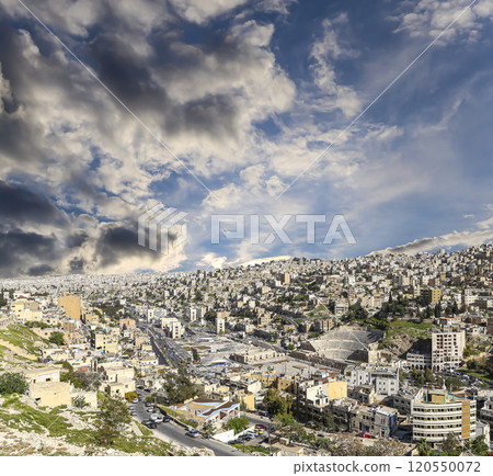 Amman city landmarks-- old roman Citadel Hill, Jordan. Against the background of a beautiful sky with clouds Amman city landmarks-- old roman Citadel Hill, Jordan. Against the background of a beautiful sky with clouds 120550072