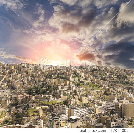 Amman city landmarks-- old roman Citadel Hill, Jordan. Against the background of a beautiful sky with clouds Amman city landmarks-- old roman Citadel Hill, Jordan. Against the background of a beautiful sky with clouds 120550091
