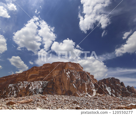 Mountains of Wadi Rum Desert also known as The Valley of the Moon is a valley cut into the sandstone and granite rock in southern Jordan 60 km to the east of Aqaba Mountains of Wadi Rum Desert also known as The Valley of the Moon is a valley cut into the sandstone and granite rock in southern Jordan 60 km to the east of Aqaba 120550277